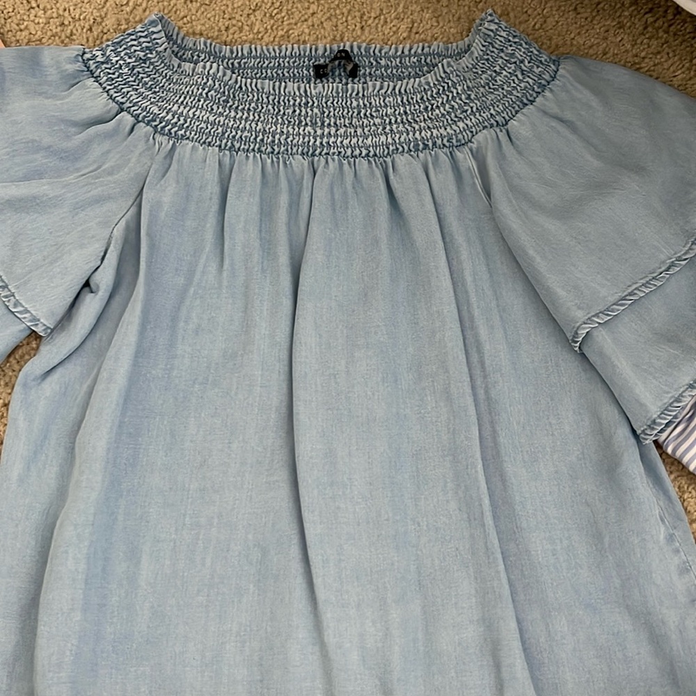 This blue denim off the shoulder top from Cotton on is in a size XS.